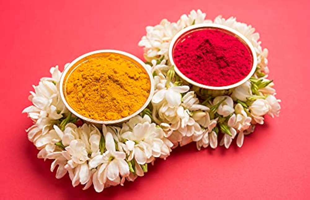 Fill one side with haldi and the other with kumkum