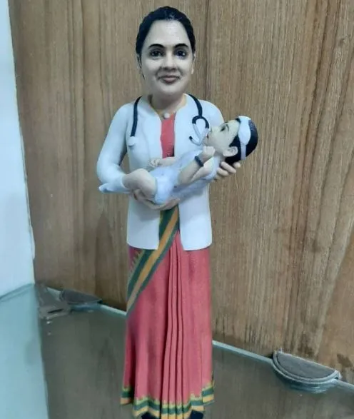 Doctor carrying Baby Miniature